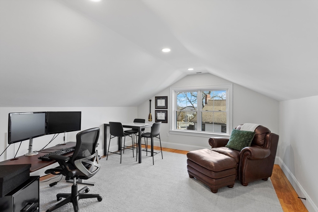 96 Winchester Road Arlington, MA 02474 - Photo 25 of 34 a living room with furniture a large window and a flat screen tv