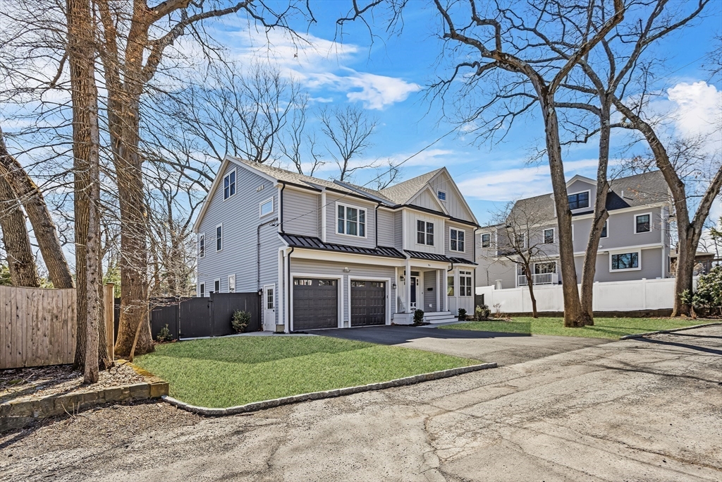 96 Winchester Road Arlington, MA 02474 - Photo 34 of 34 a view of a building with a yard