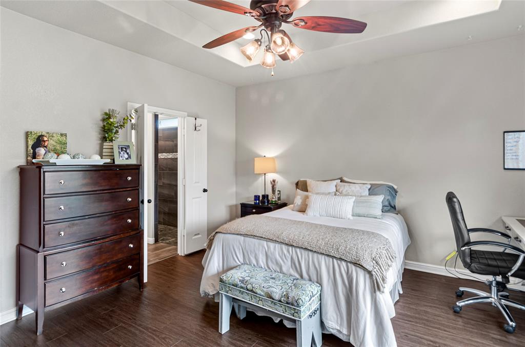 6093 Farm To Market Road 730 North Decatur, TX 76234 - Photo 11 of 28 a bedroom with a bed and a chandelier