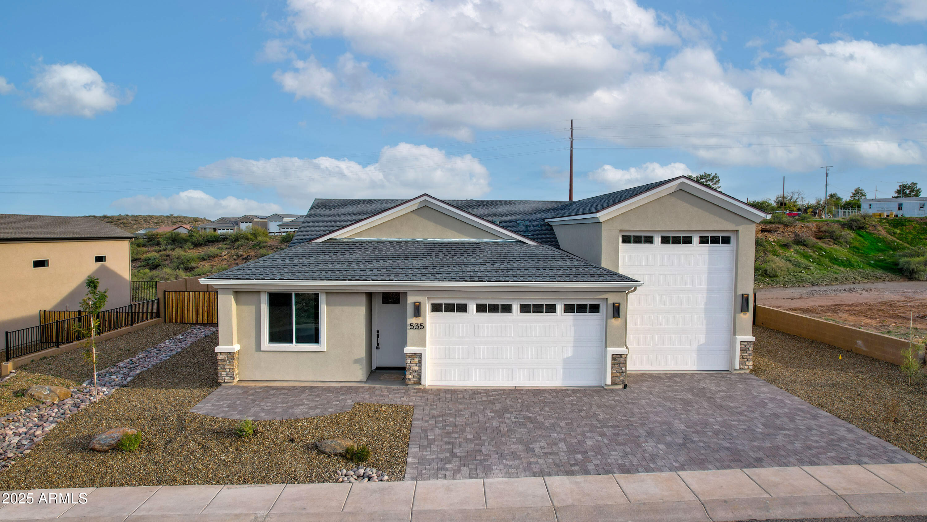a front view of a house with garden