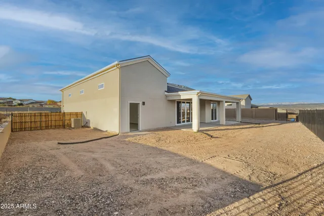 a picture of a room with a floor and a white wall