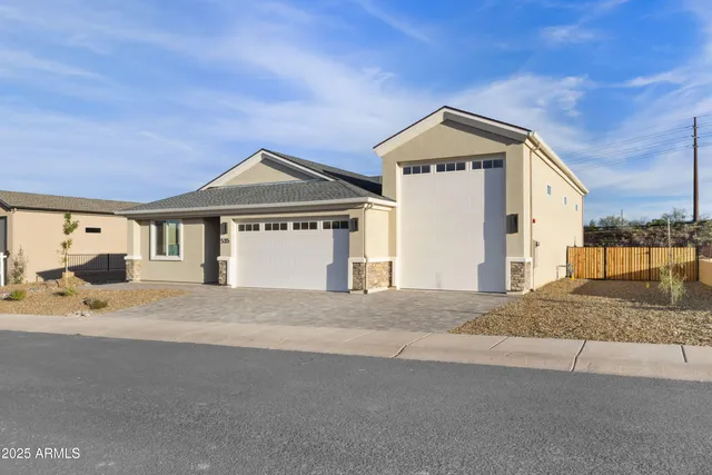 a room with lots of furniture and a large window