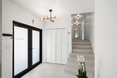 an aerial view of a house with a garden and yard