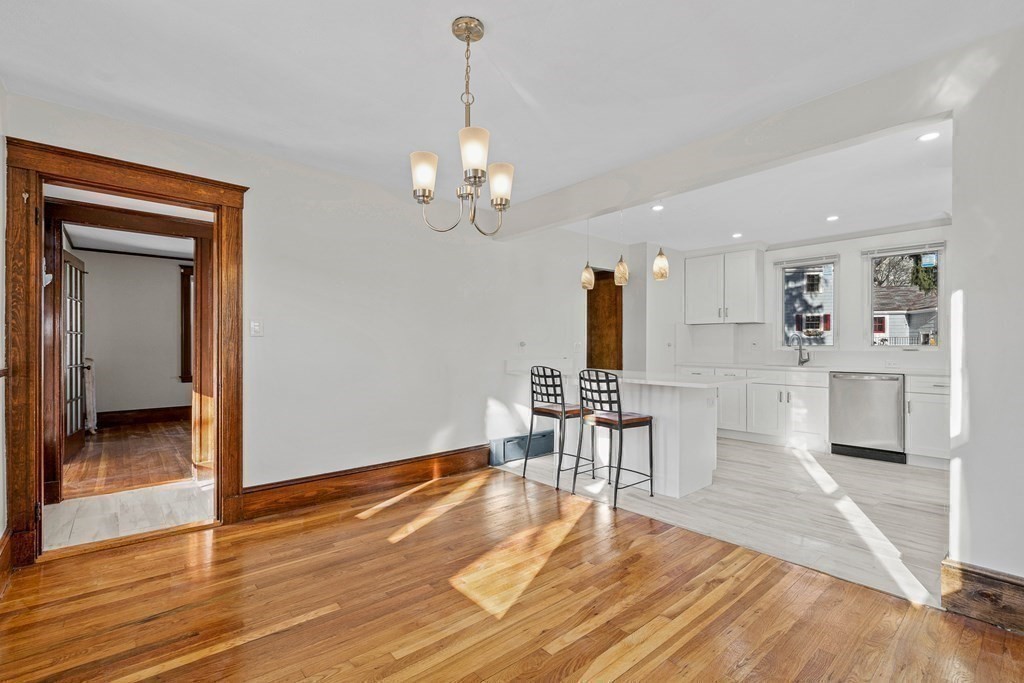 9 Upland Road Winchester, MA 01890 - Photo 14 of 42 a view of a room with wooden floor and staircase