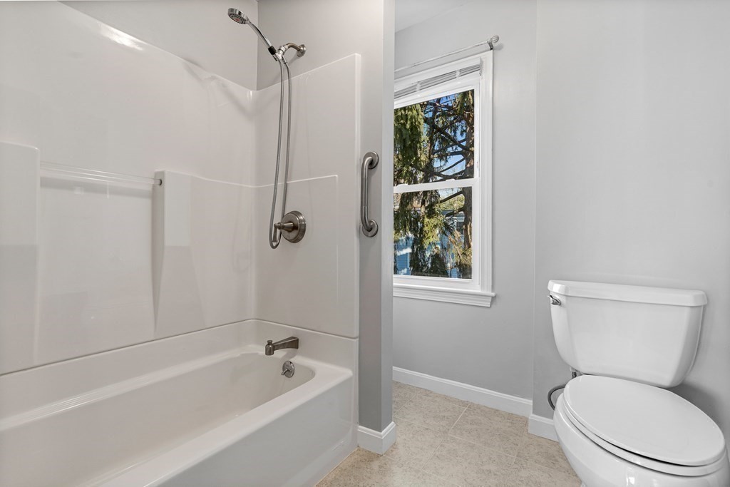 9 Upland Road Winchester, MA 01890 - Photo 22 of 42 a bathroom with a toilet and shower
