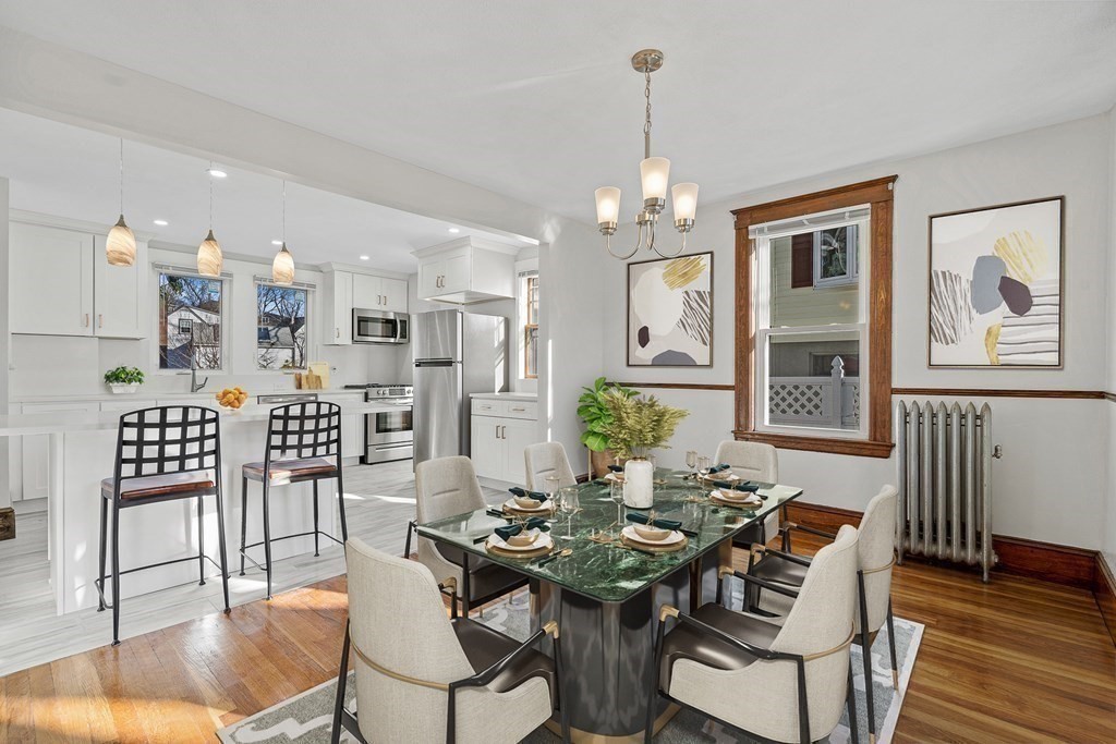 9 Upland Road Winchester, MA 01890 - Photo 3 of 42 a view of a dining room with furniture and wooden floor
