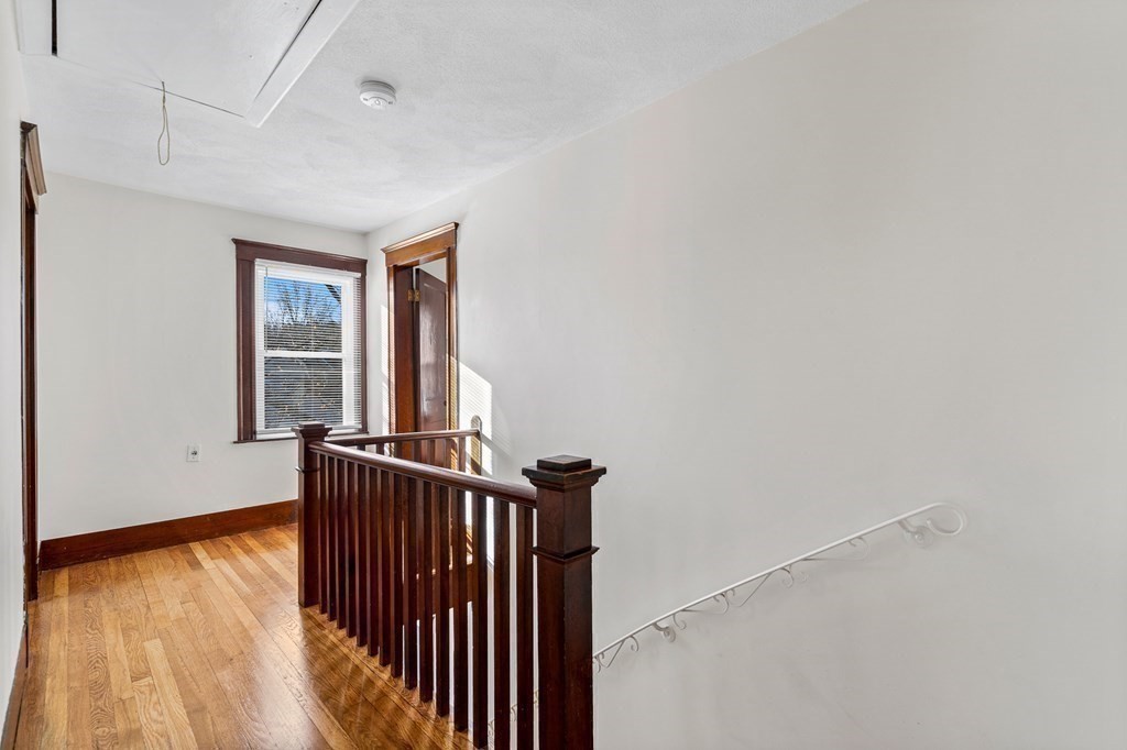 9 Upland Road Winchester, MA 01890 - Photo 32 of 42 a view of hallway with wooden floor
