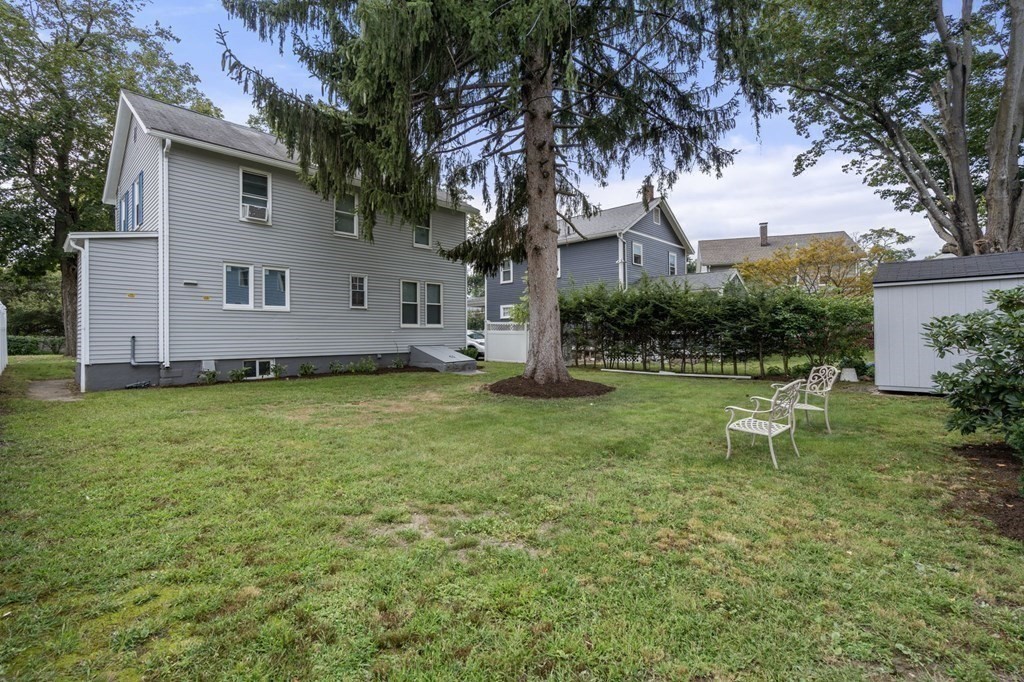 9 Upland Road Winchester, MA 01890 - Photo 36 of 42 a view of a house with backyard and garden