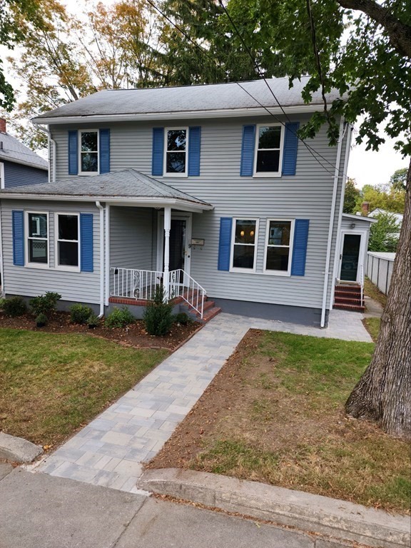 9 Upland Road Winchester, MA 01890 - Photo 42 of 42 a front view of a house with garden