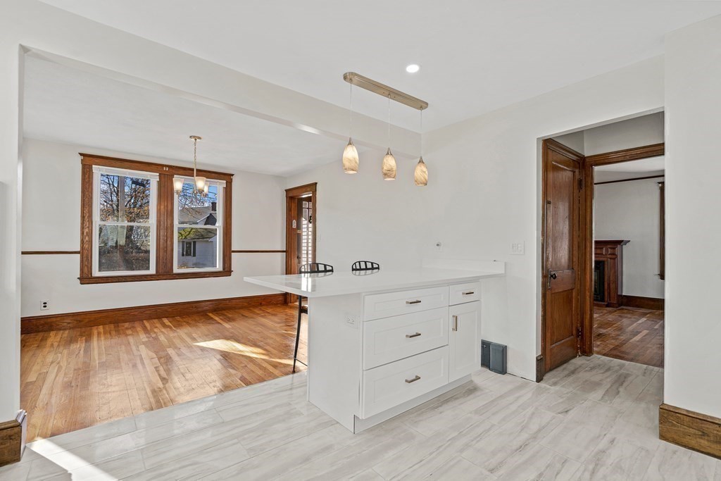 9 Upland Road Winchester, MA 01890 - Photo 10 of 42 a view of room with window and hardwood floor