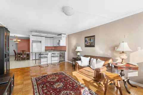 a kitchen with stainless steel appliances kitchen island granite countertop a sink and cabinets