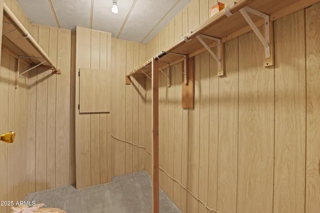 a bathroom with a shower and a glass door