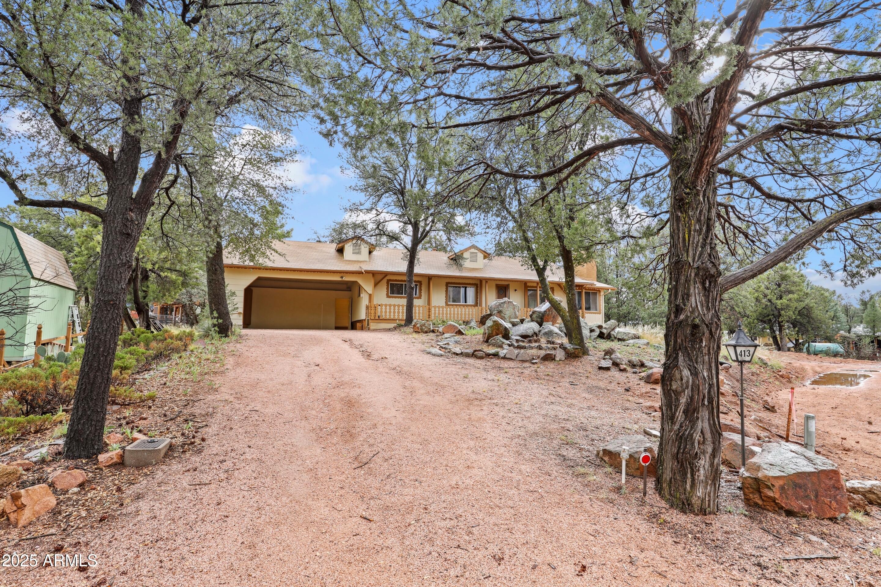 413 East Idle Circle Payson, AZ 85541 - Photo 23 of 24 a view of a yard with a tree