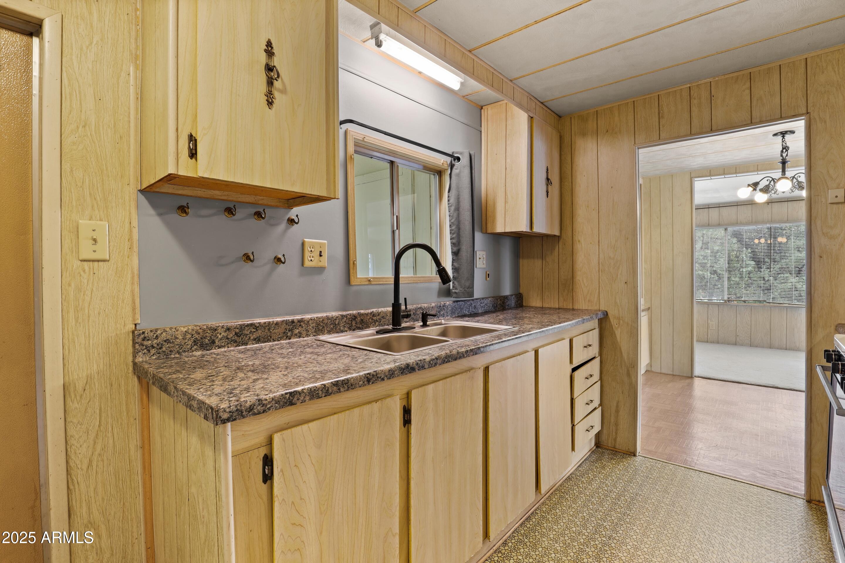 413 East Idle Circle Payson, AZ 85541 - Photo 7 of 24 a bathroom with a granite countertop sink and a mirror