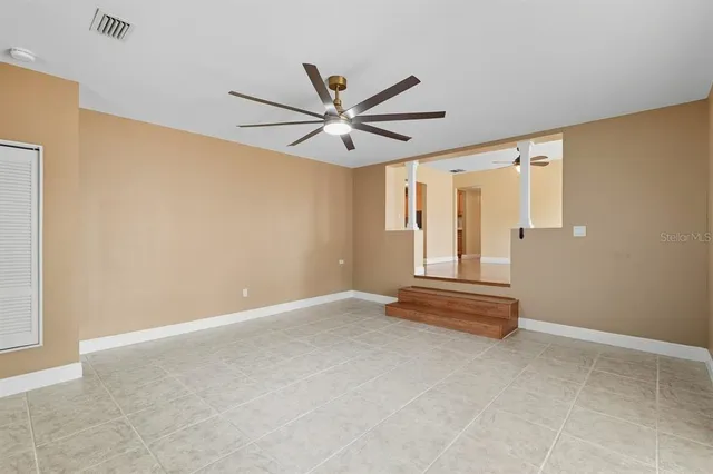 a view of livingroom with hardwood floor and a ceiling fan