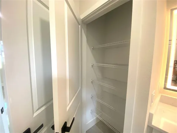a bathroom with a glass shower door