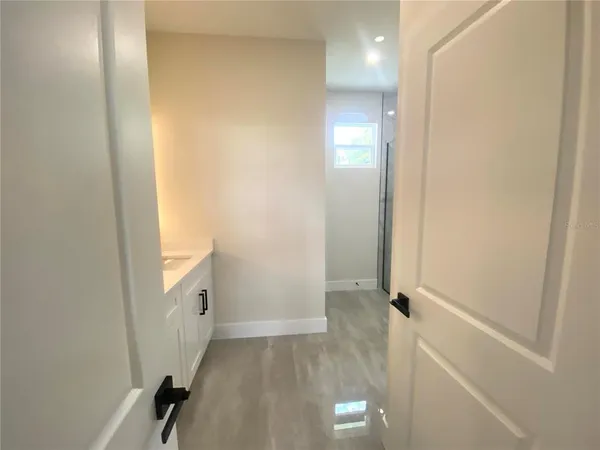 a view of a hallway with closet
