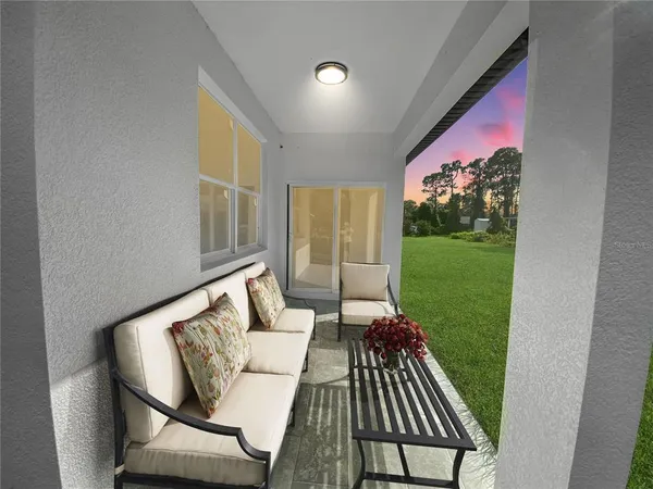 a living room with furniture and a yard