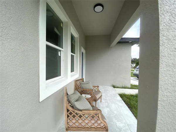 a bedroom with furniture and window