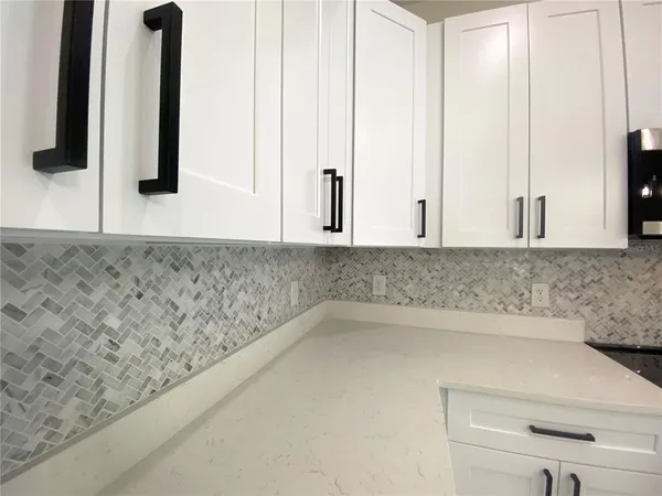 a bathroom with a bathtub and mirror