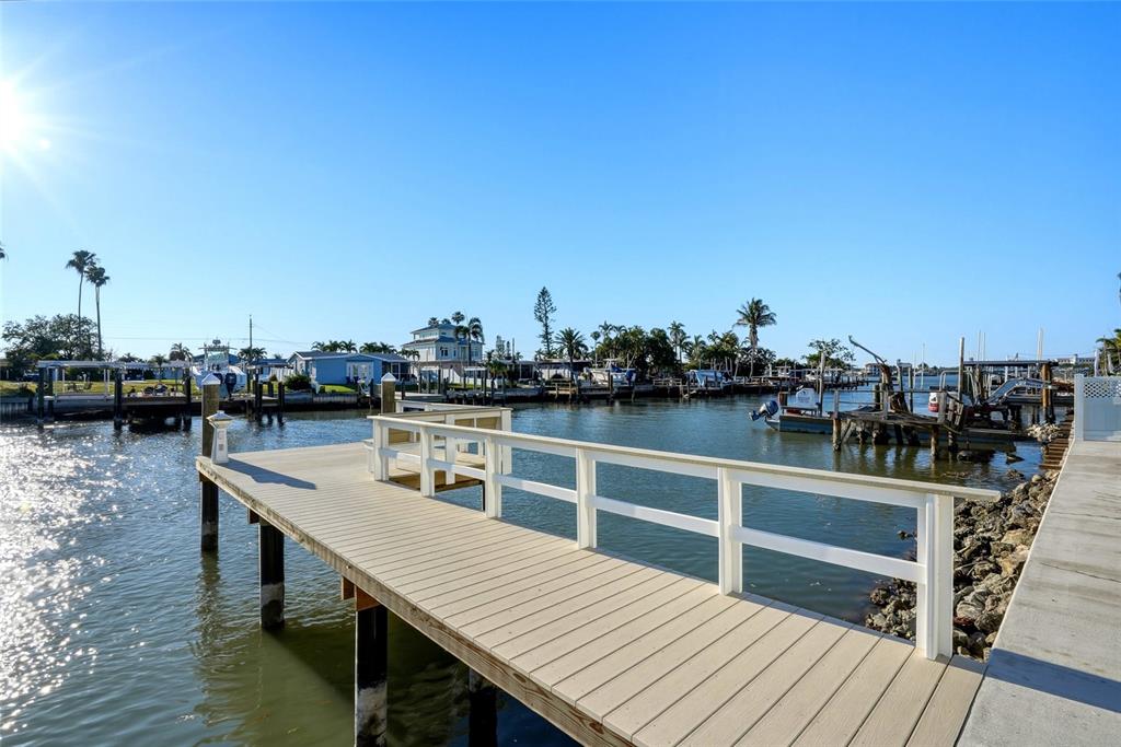 534 Crystal Drive Madeira Beach, FL 33708 - Photo 53 of 68 a view of a roof deck with two chairs and wooden floor