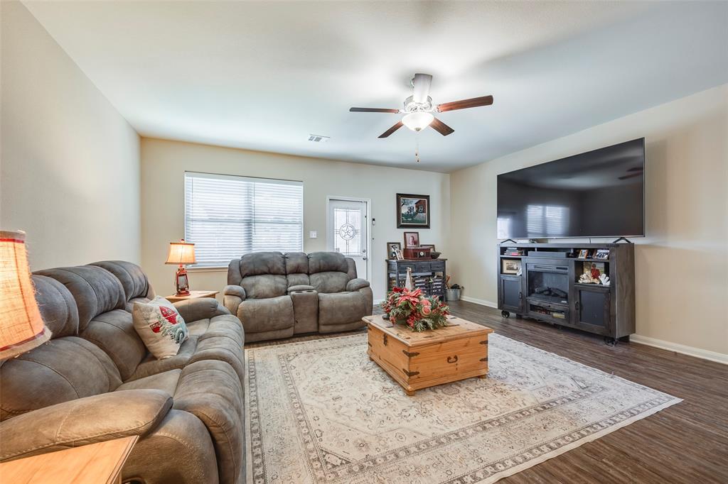 1832 Tyne Way Crowley, TX 76036 - Photo 12 of 25 a living room with furniture and a flat screen tv