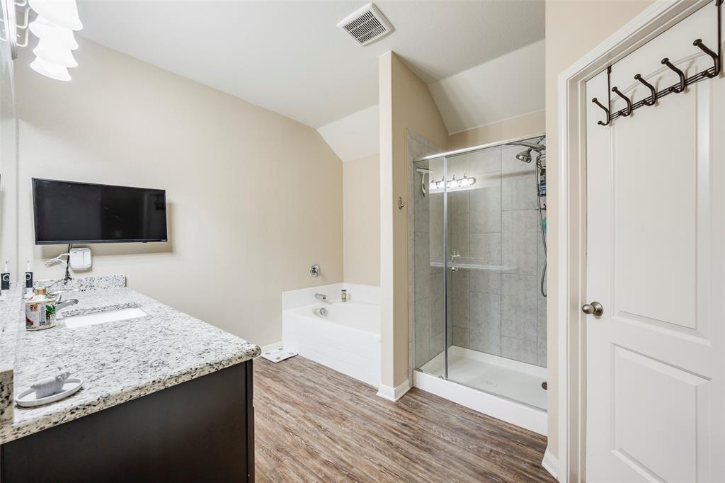 1832 Tyne Way Crowley, TX 76036 - Photo 17 of 25 a bathroom with a granite countertop sink shower and a mirror