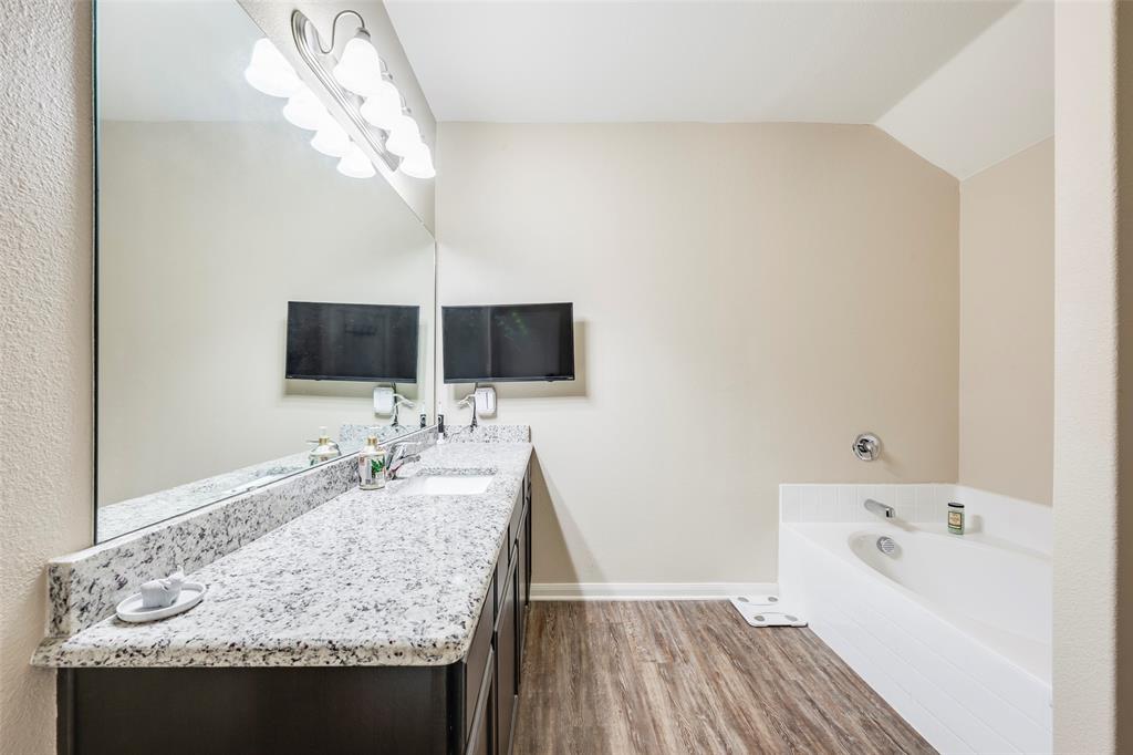 1832 Tyne Way Crowley, TX 76036 - Photo 18 of 25 a bathroom with a sink and a mirror
