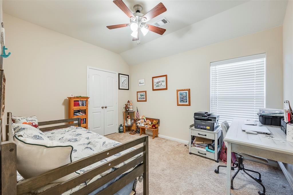 1832 Tyne Way Crowley, TX 76036 - Photo 21 of 25 a bedroom with a bed and a desk