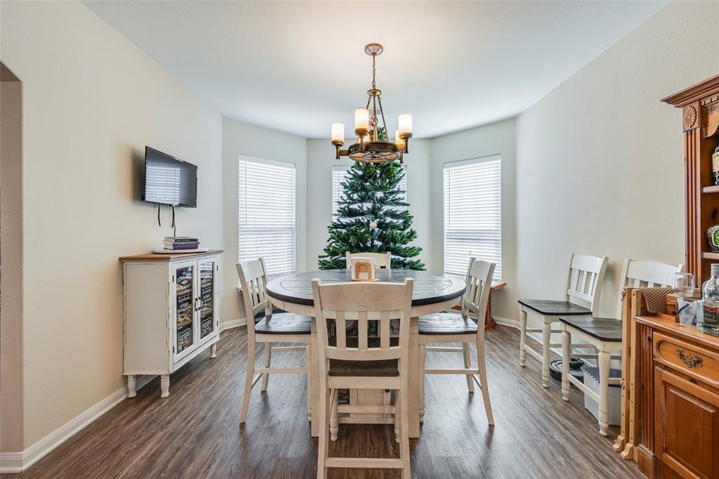 1832 Tyne Way Crowley, TX 76036 - Photo 4 of 25 a view of a dining room with furniture window and wooden floor