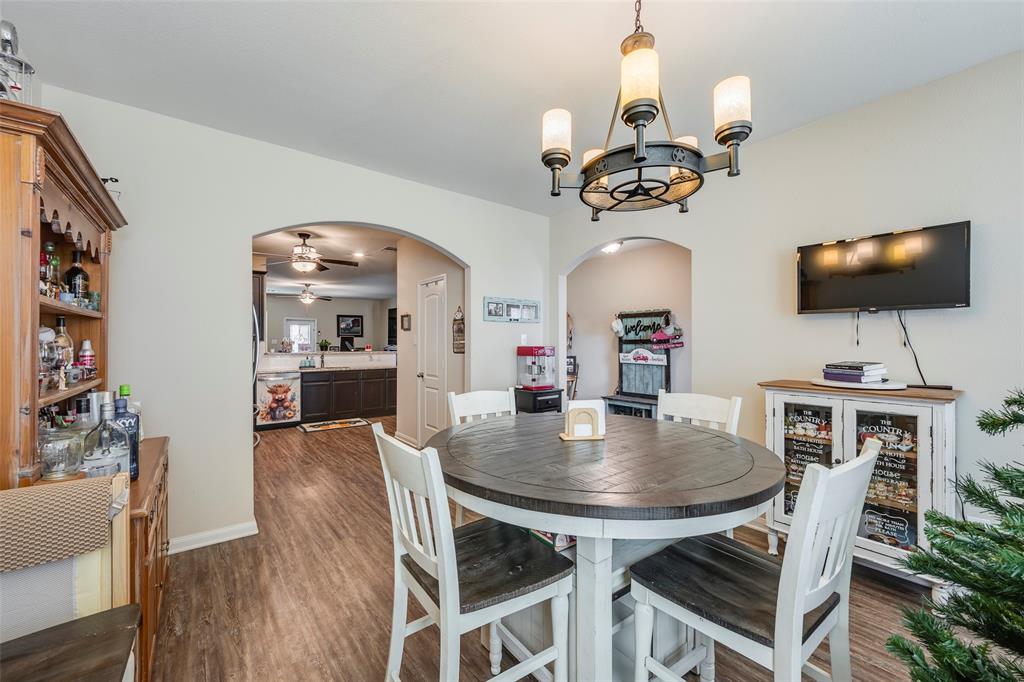 1832 Tyne Way Crowley, TX 76036 - Photo 5 of 25 a view of a dining room with furniture and wooden floor