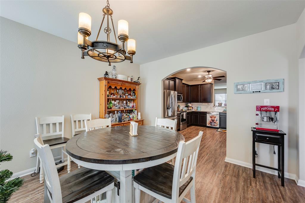 1832 Tyne Way Crowley, TX 76036 - Photo 6 of 25 a view of a dining room with furniture and wooden floor