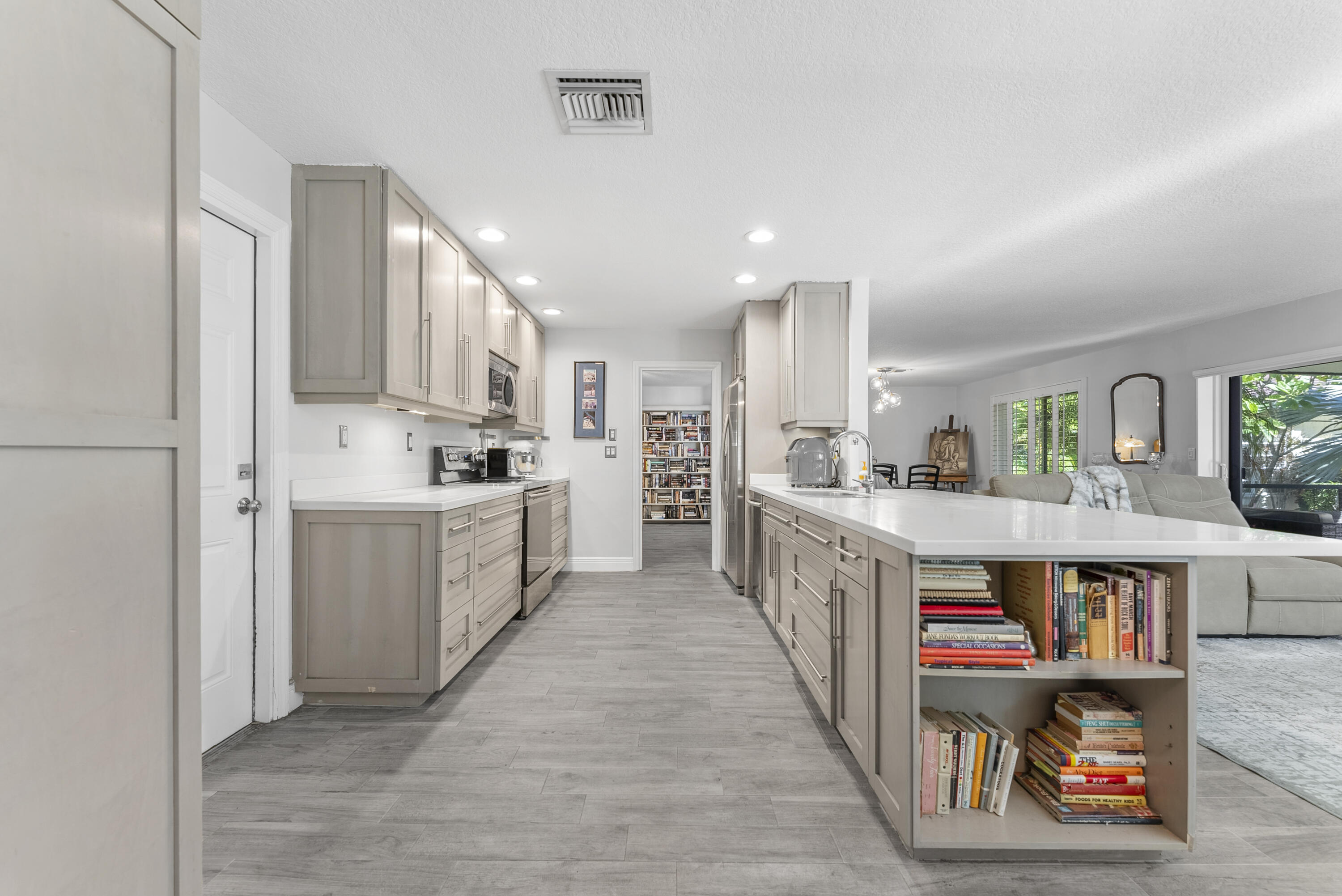334 Northwest 42nd Street Boca Raton, FL 33431 - Photo 20 of 48 a large kitchen with a lot of counter space