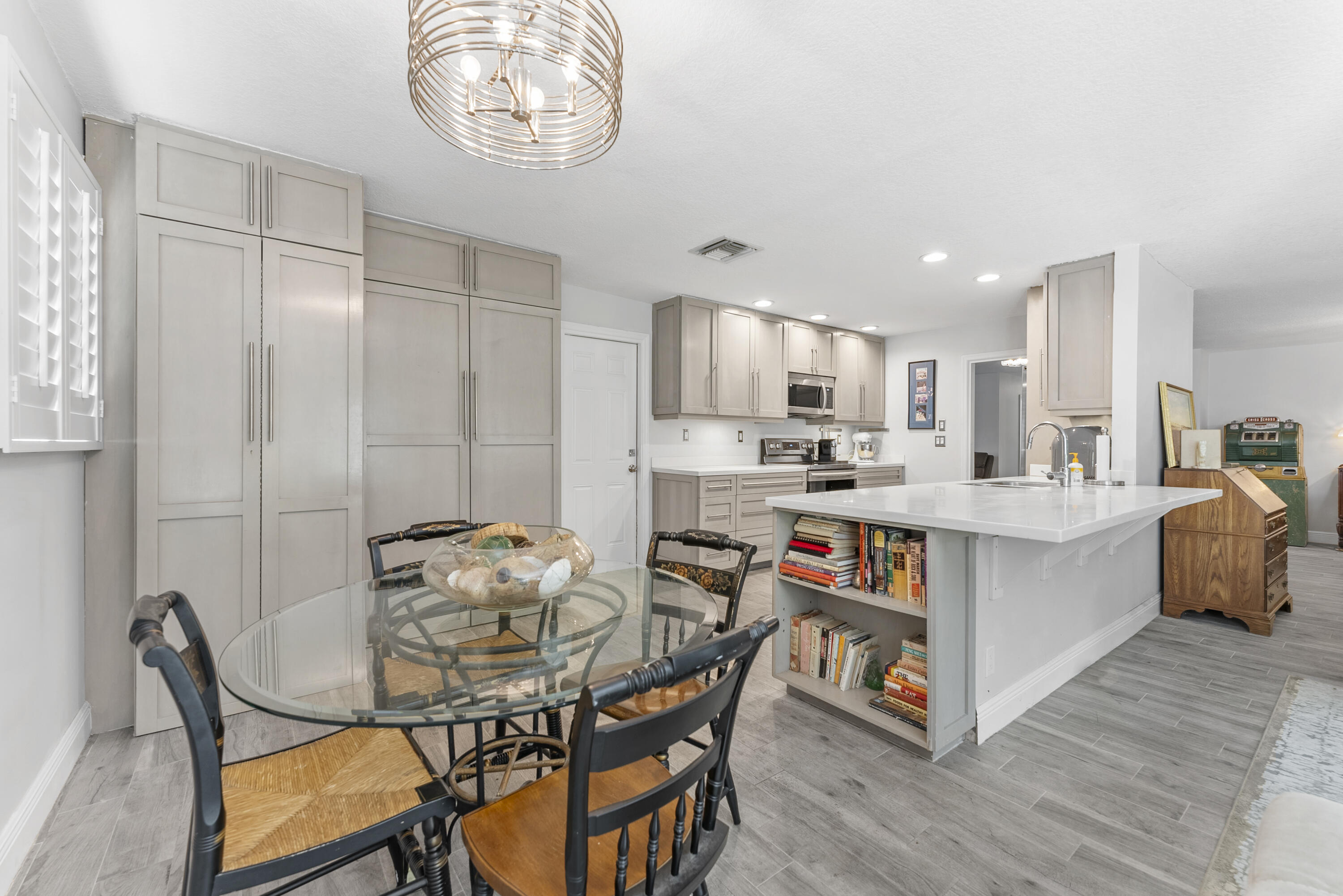 334 Northwest 42nd Street Boca Raton, FL 33431 - Photo 24 of 48 a view of kitchen with cabinets and wooden floor