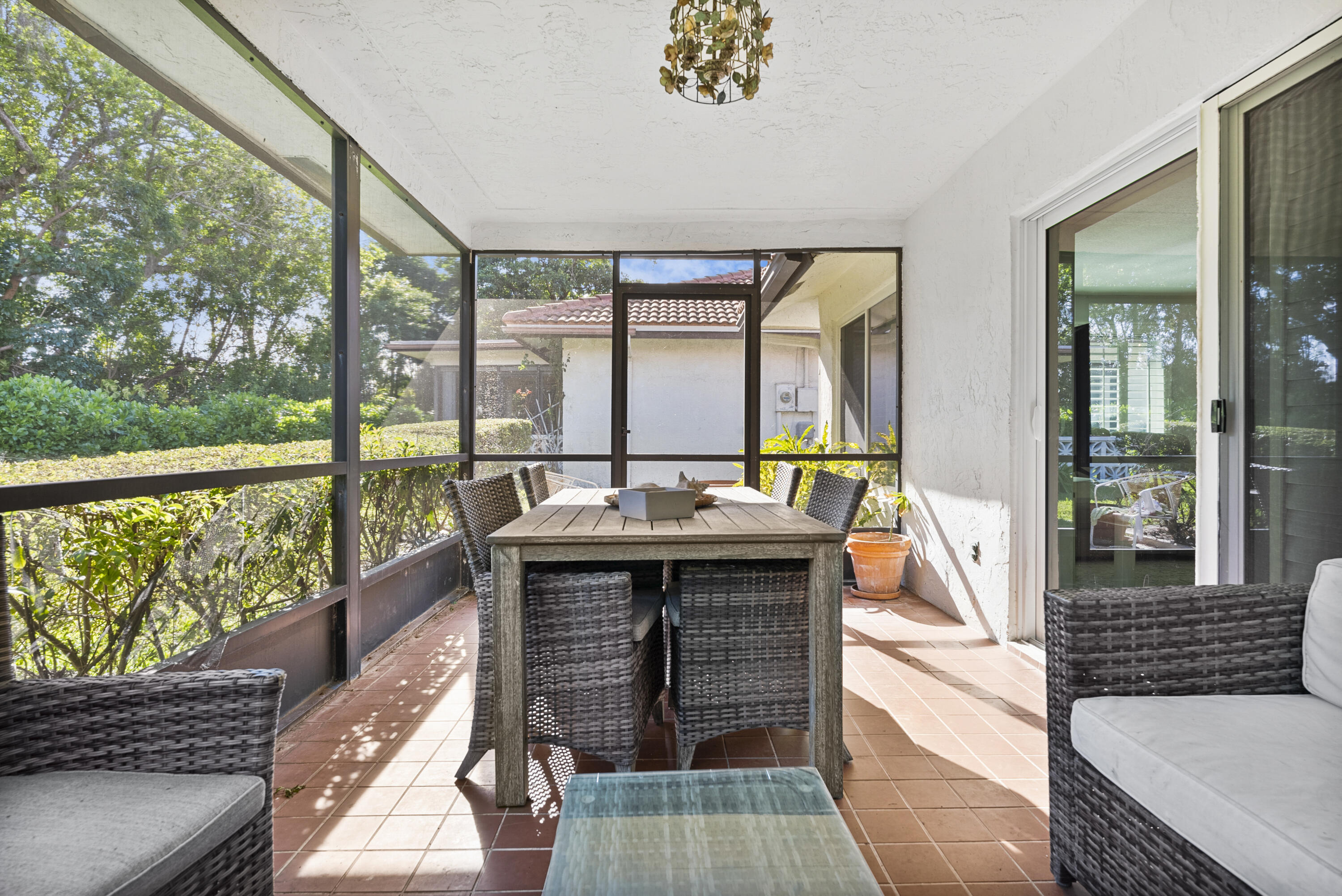 334 Northwest 42nd Street Boca Raton, FL 33431 - Photo 40 of 48 a living room with a large window and a table