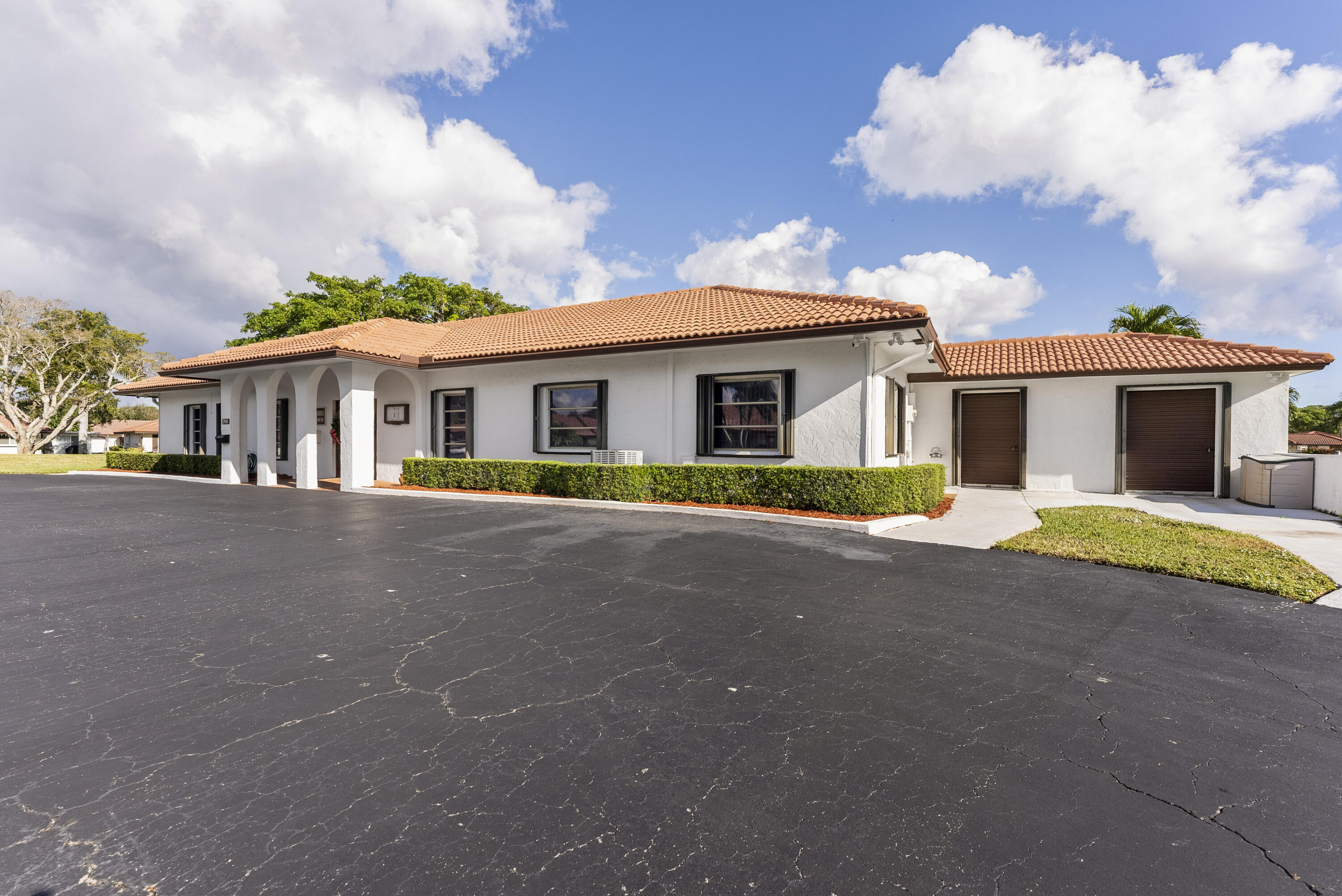 334 Northwest 42nd Street Boca Raton, FL 33431 - Photo 42 of 48 a view of house with outdoor space and large trees