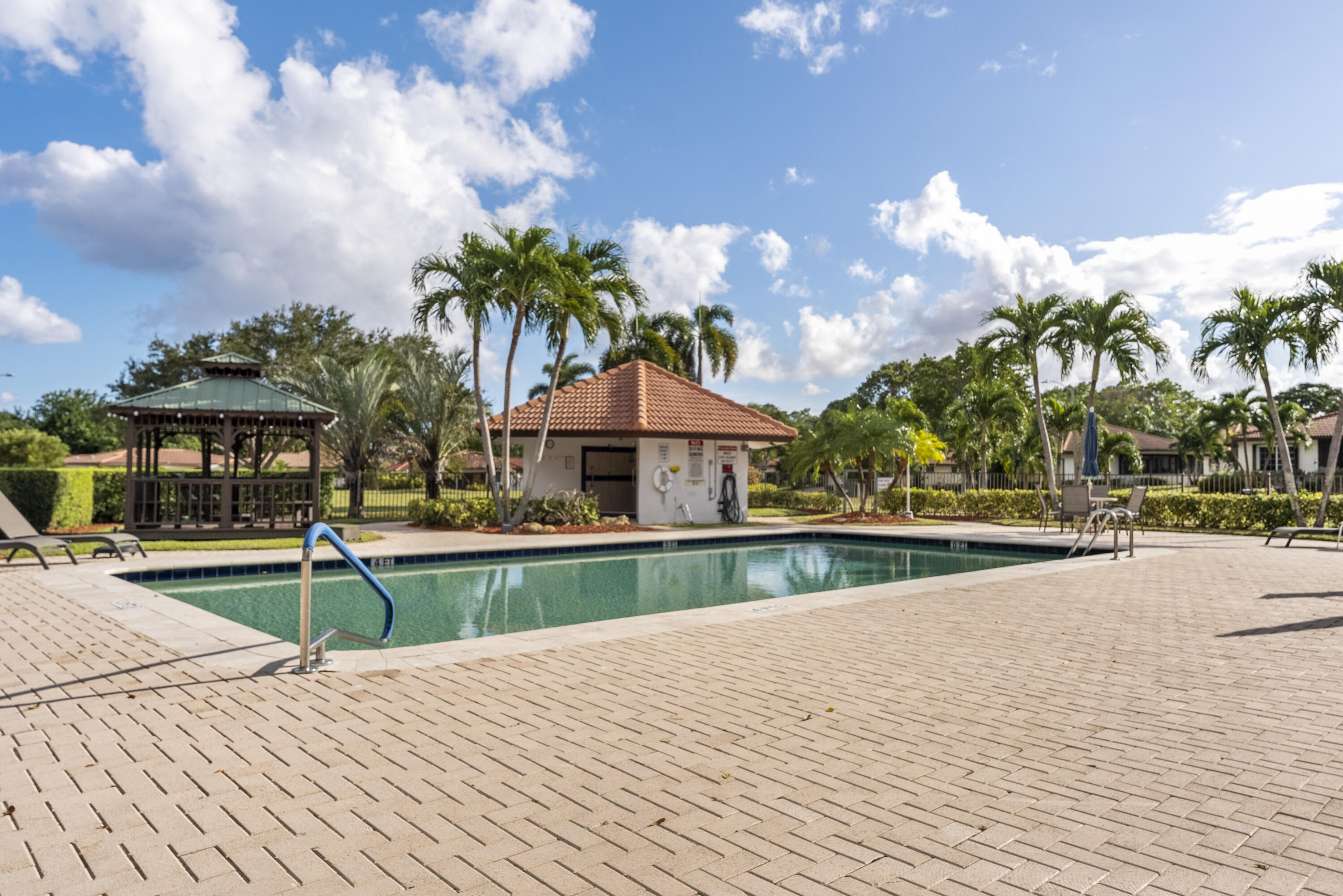 334 Northwest 42nd Street Boca Raton, FL 33431 - Photo 46 of 48 a view of a house with swimming pool and sitting area