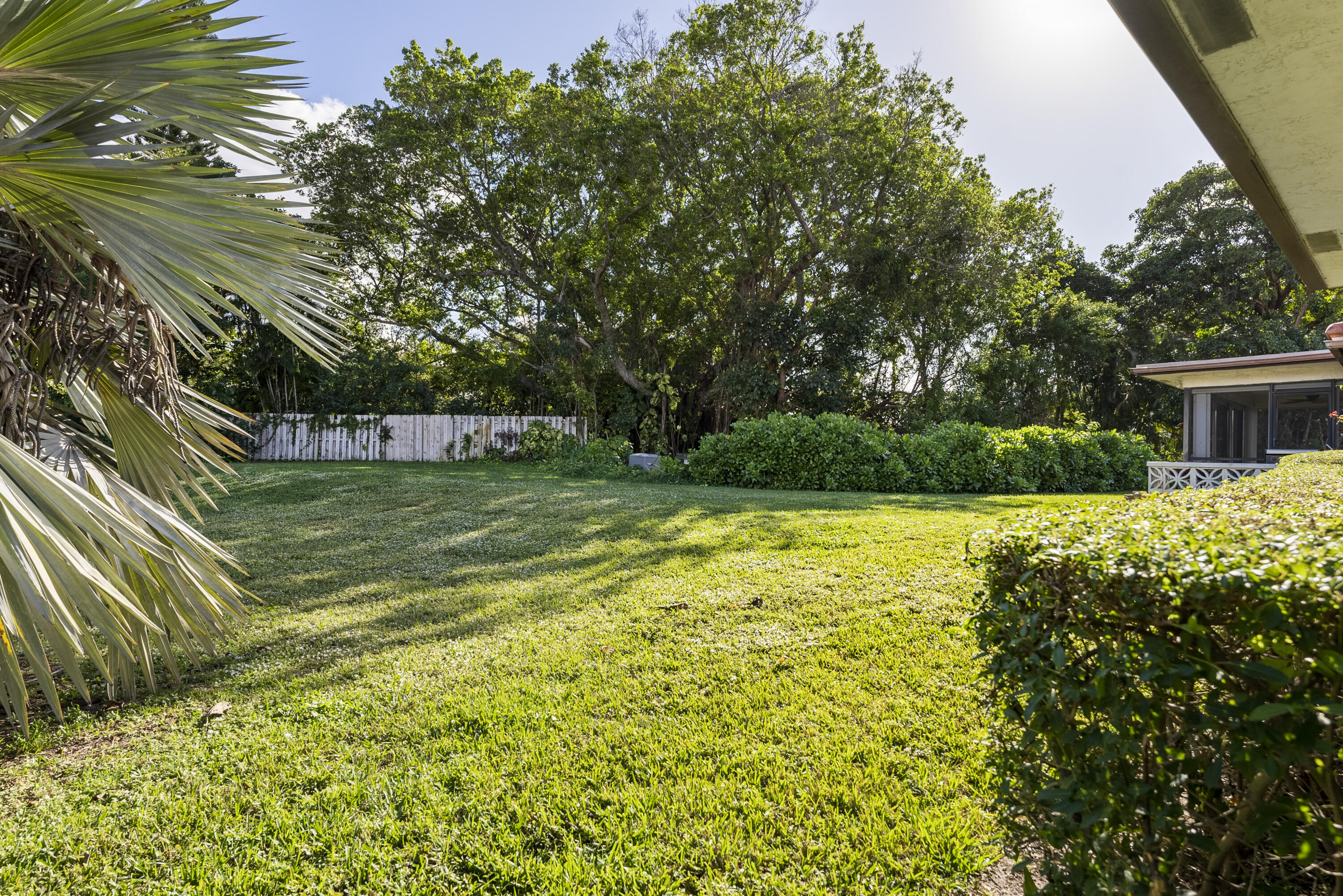 334 Northwest 42nd Street Boca Raton, FL 33431 - Photo 6 of 48 a view of a house with a yard