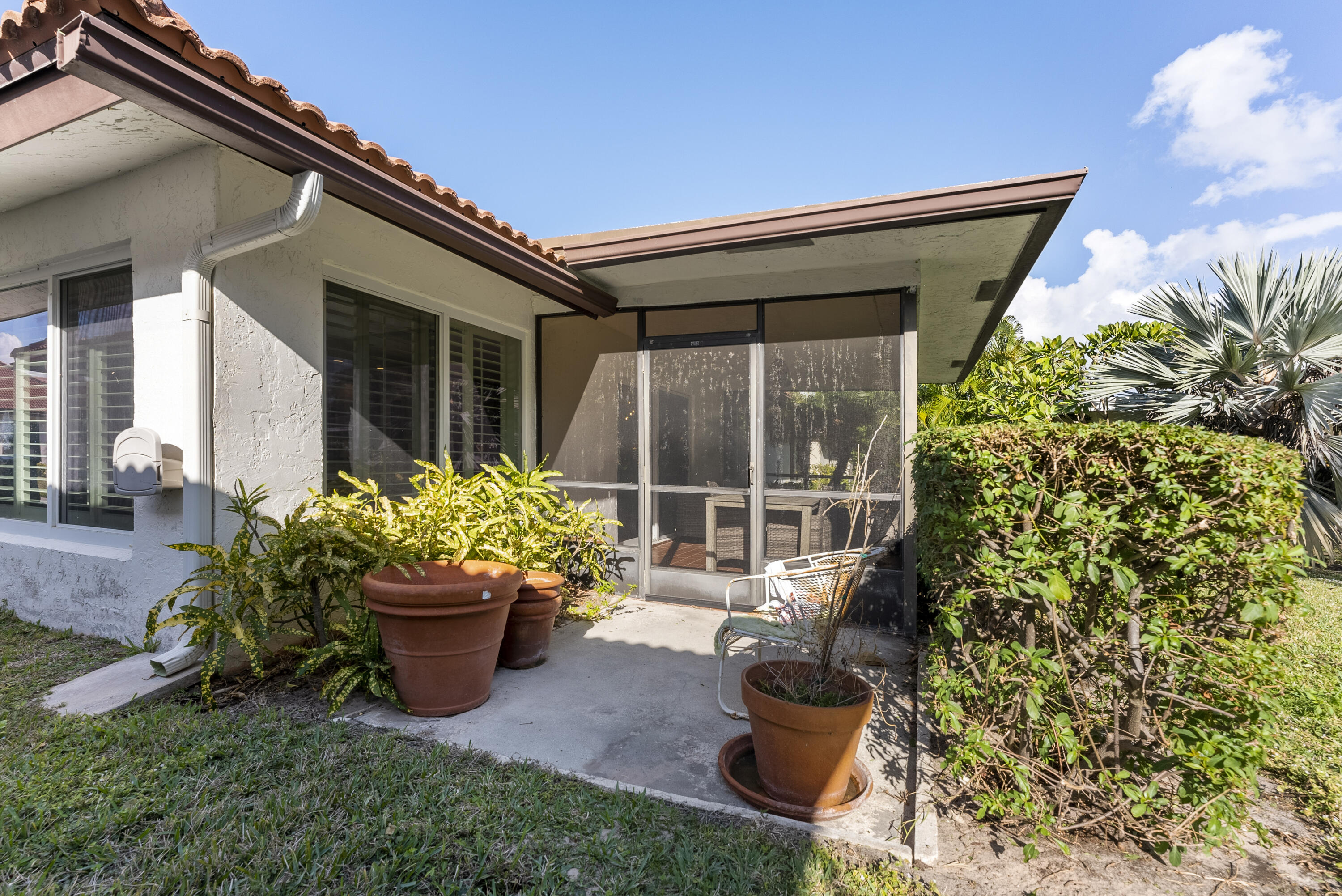 334 Northwest 42nd Street Boca Raton, FL 33431 - Photo 8 of 48 a house with a garden view