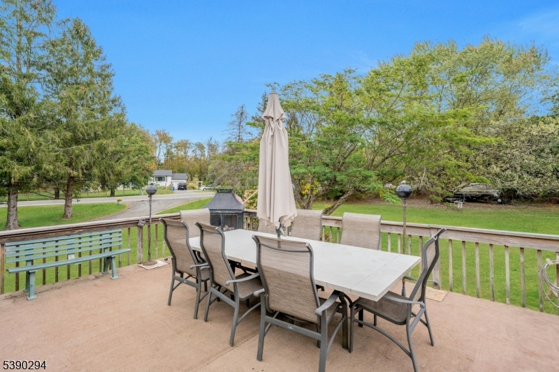 305 Wykertown Road Branchville, NJ 07826 - Photo 22 of 31 a view of a patio with a table chairs and a table