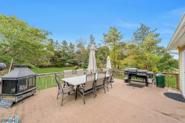 a view of a patio with a table and chairs