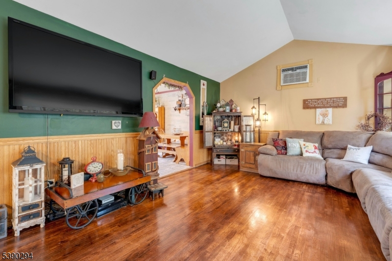 305 Wykertown Road Branchville, NJ 07826 - Photo 6 of 31 a living room with furniture and a flat screen tv