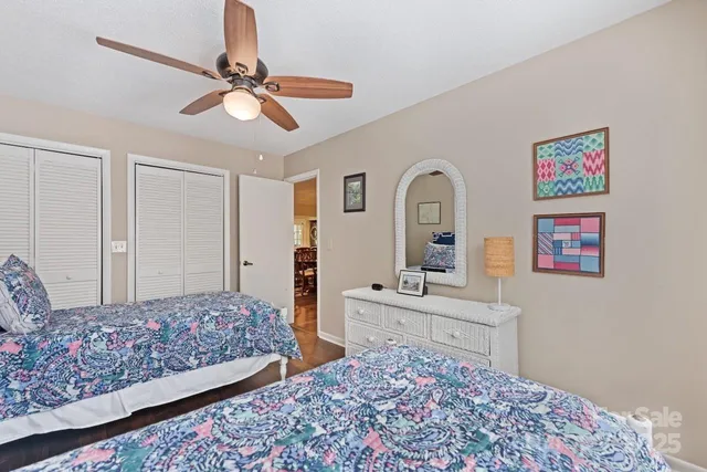 a bathroom with a granite countertop toilet sink and a mirror