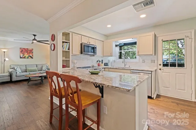 a kitchen with a stove and cabinets