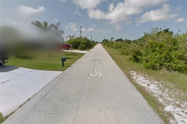 an aerial view of a houses with outdoor space