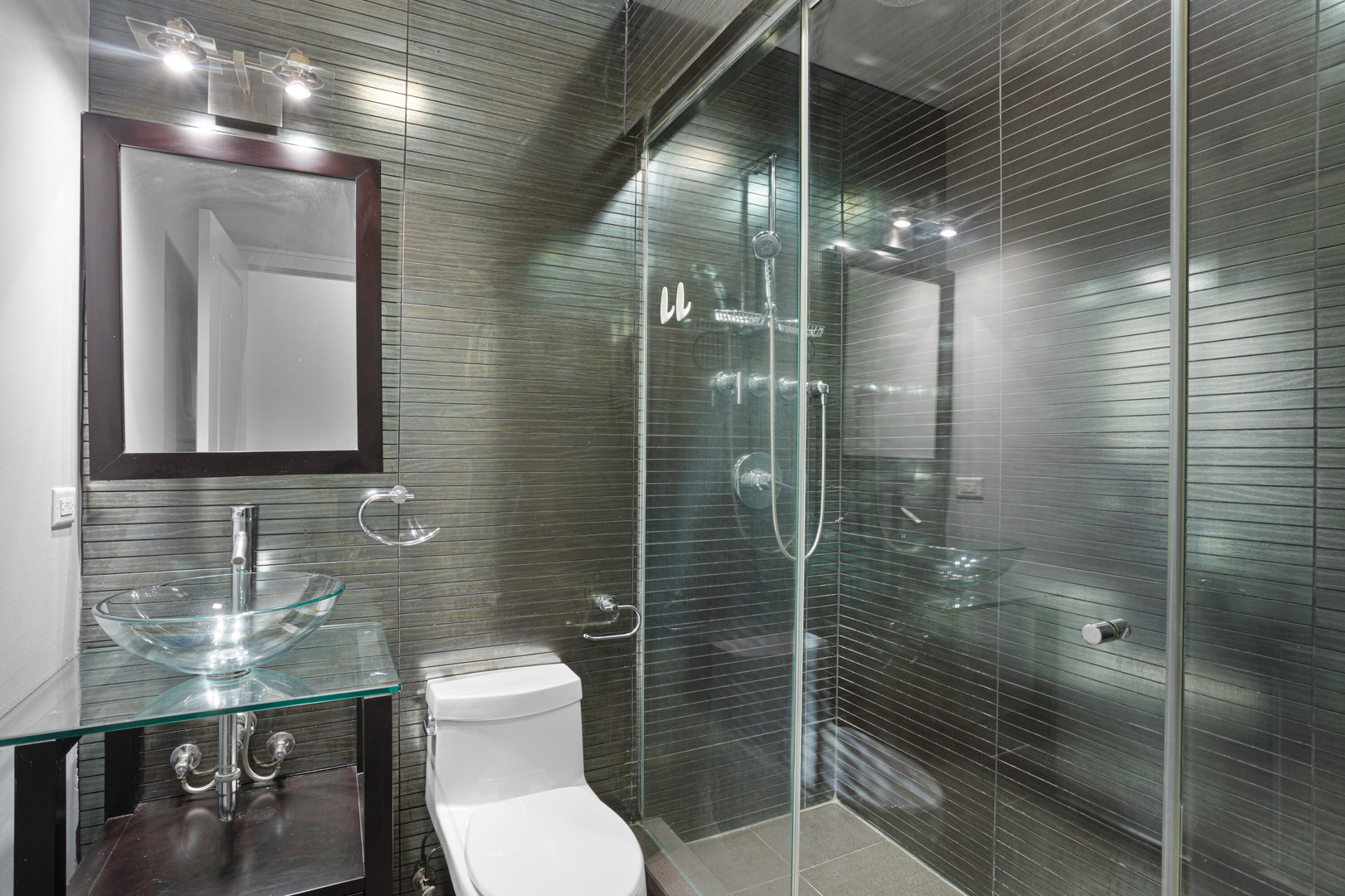 1412 West Morse Avenue, Unit 4B Chicago, IL 60626 - Photo 12 of 16 a bathroom with a toilet and a shower