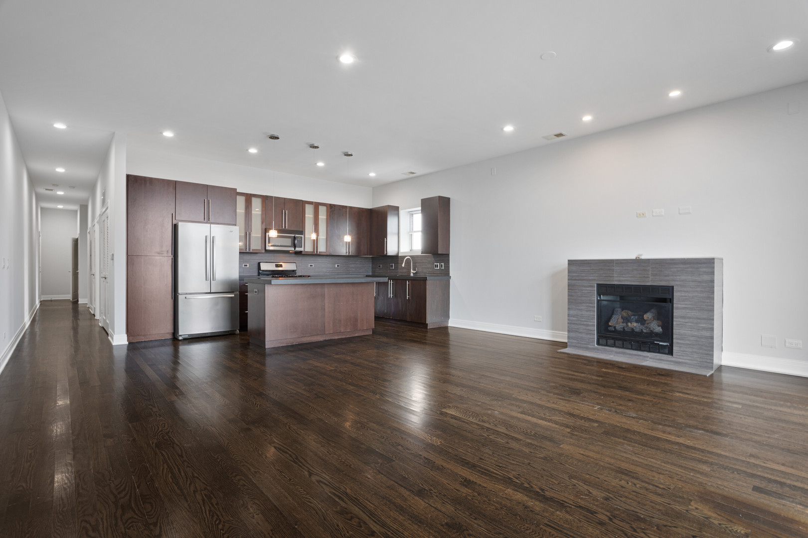 1412 West Morse Avenue, Unit 4B Chicago, IL 60626 - Photo 3 of 16 a view of kitchen with wooden floor and a refrigerator