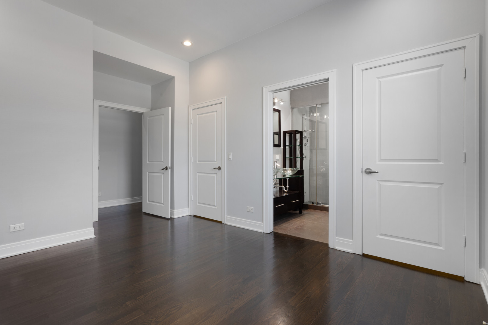 1412 West Morse Avenue, Unit 4B Chicago, IL 60626 - Photo 7 of 16 an empty room with wooden floor & closet