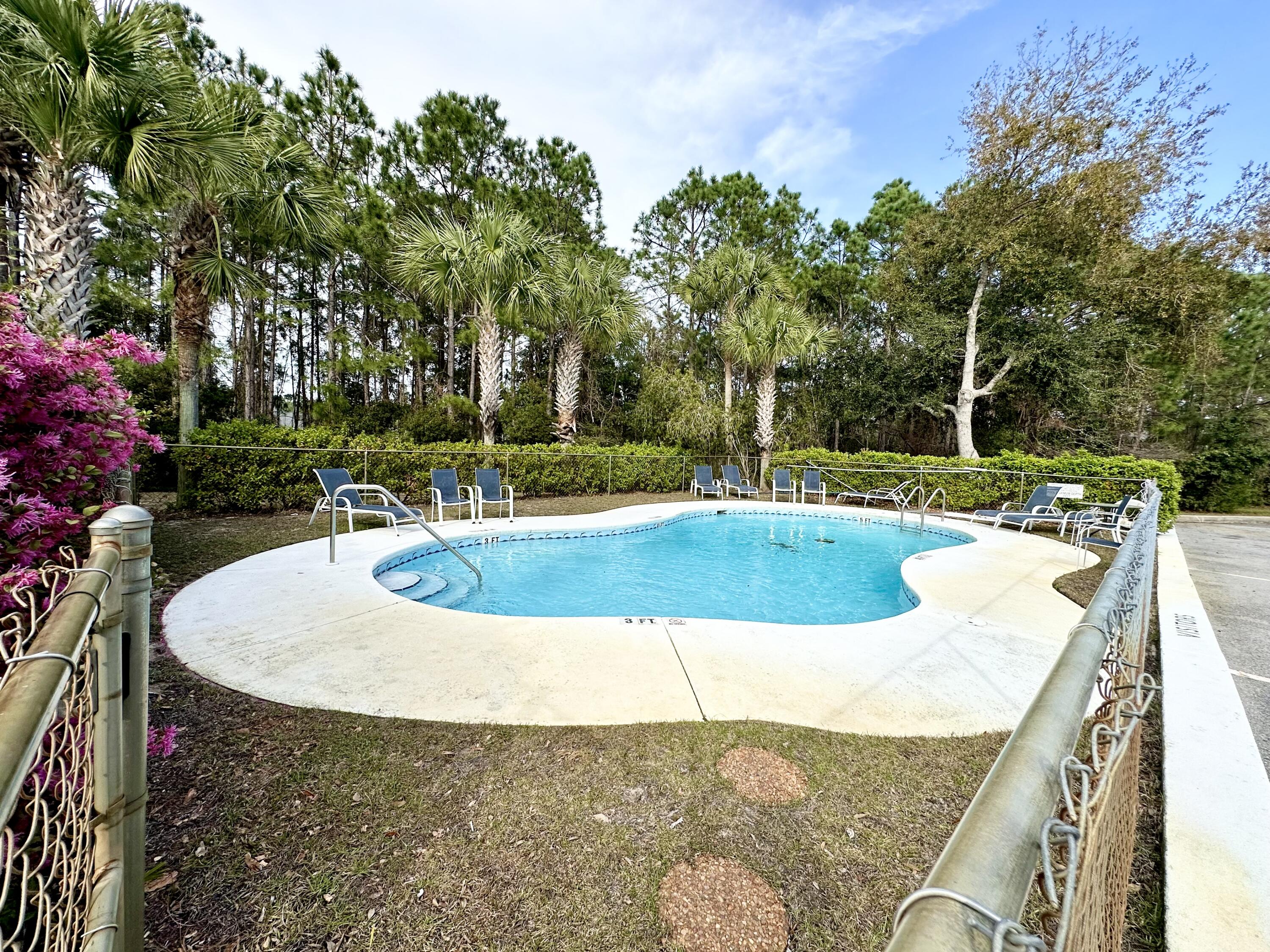 732 East Mack Bayou Drive, Unit 2 Santa Rosa Beach, FL 32459 - Photo 40 of 43 swimming pool view with a garden space
