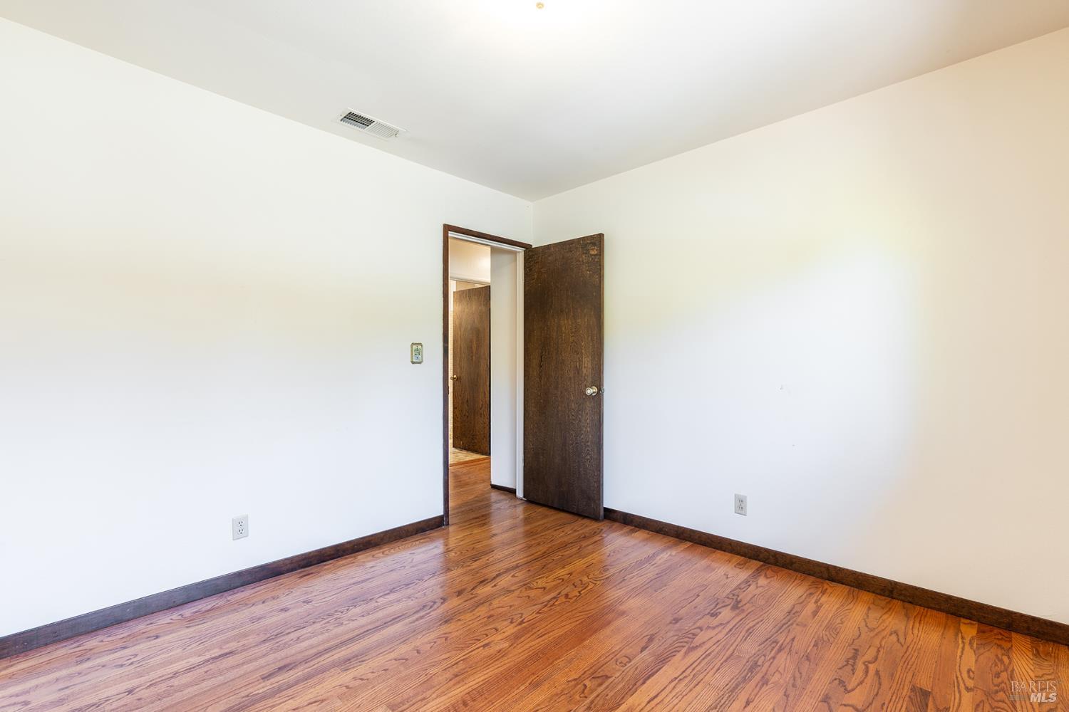 2236 West Hearn Avenue Santa Rosa, CA 95407 - Photo 26 of 56 a view of an empty room with wooden floor